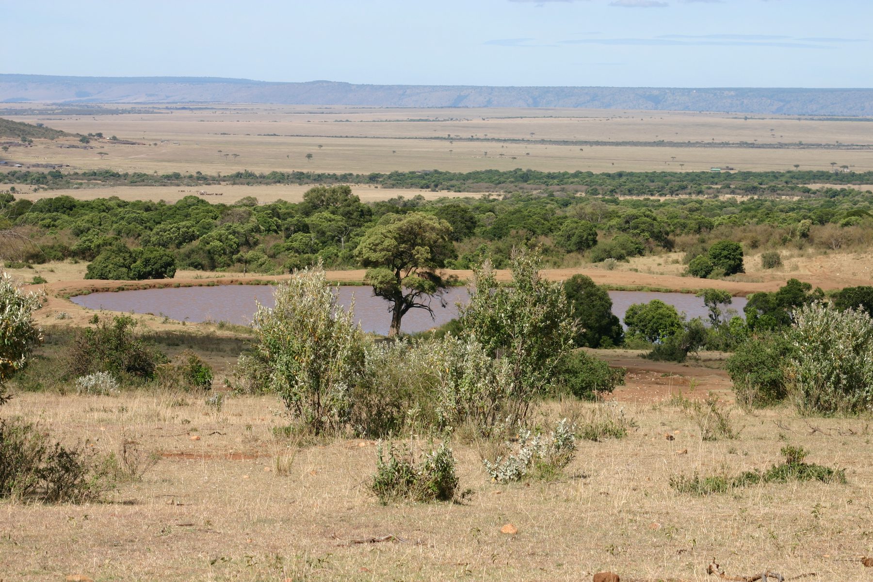 View over the Mara escarpment and a waterhole from Saruni Wild
