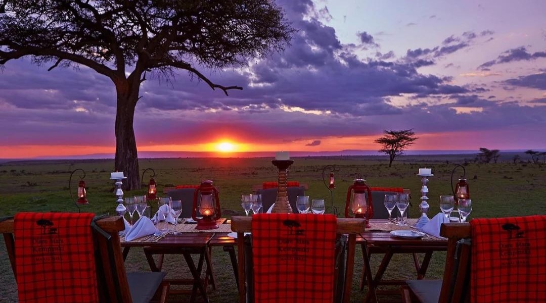Candlelit dinner under acacia trees