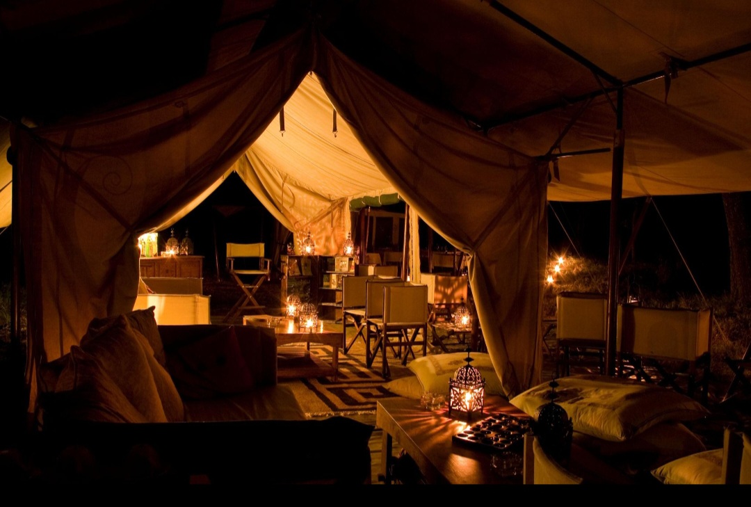 Candlelit tent interior at night